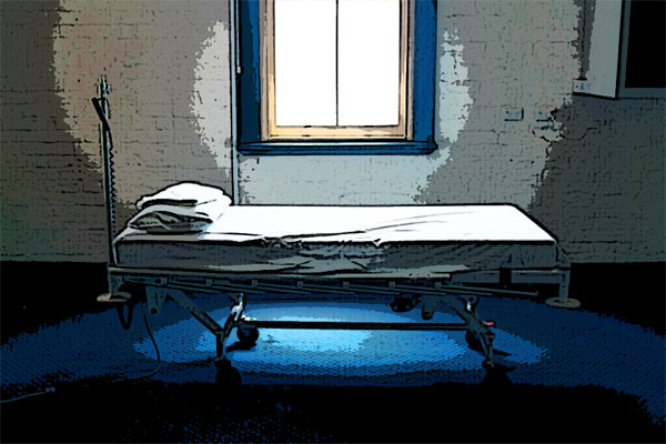 Decorative photo of empty hospital bed